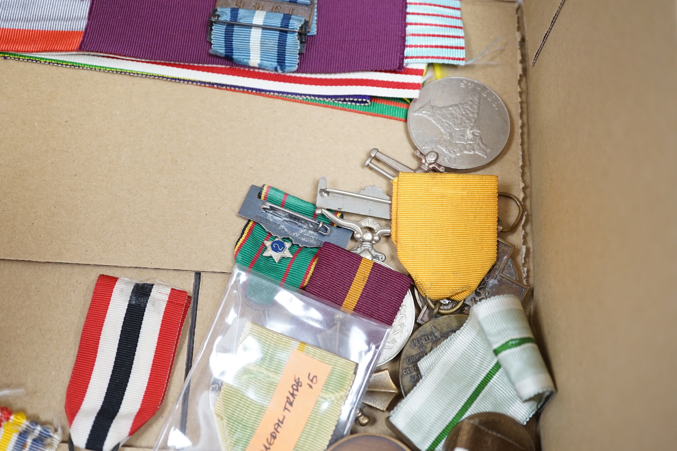 Thirty world military and commemorative medals including; a Belgium War Aid Medal 1914-18, Nigeria Republic Medal, Austri-Hungarian Medal for Bravery, Kuwaiti Liberation Medal, Pakistan Resolution Day Medal, etc.